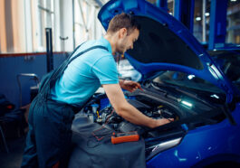 auto electrician checks electrical circuits